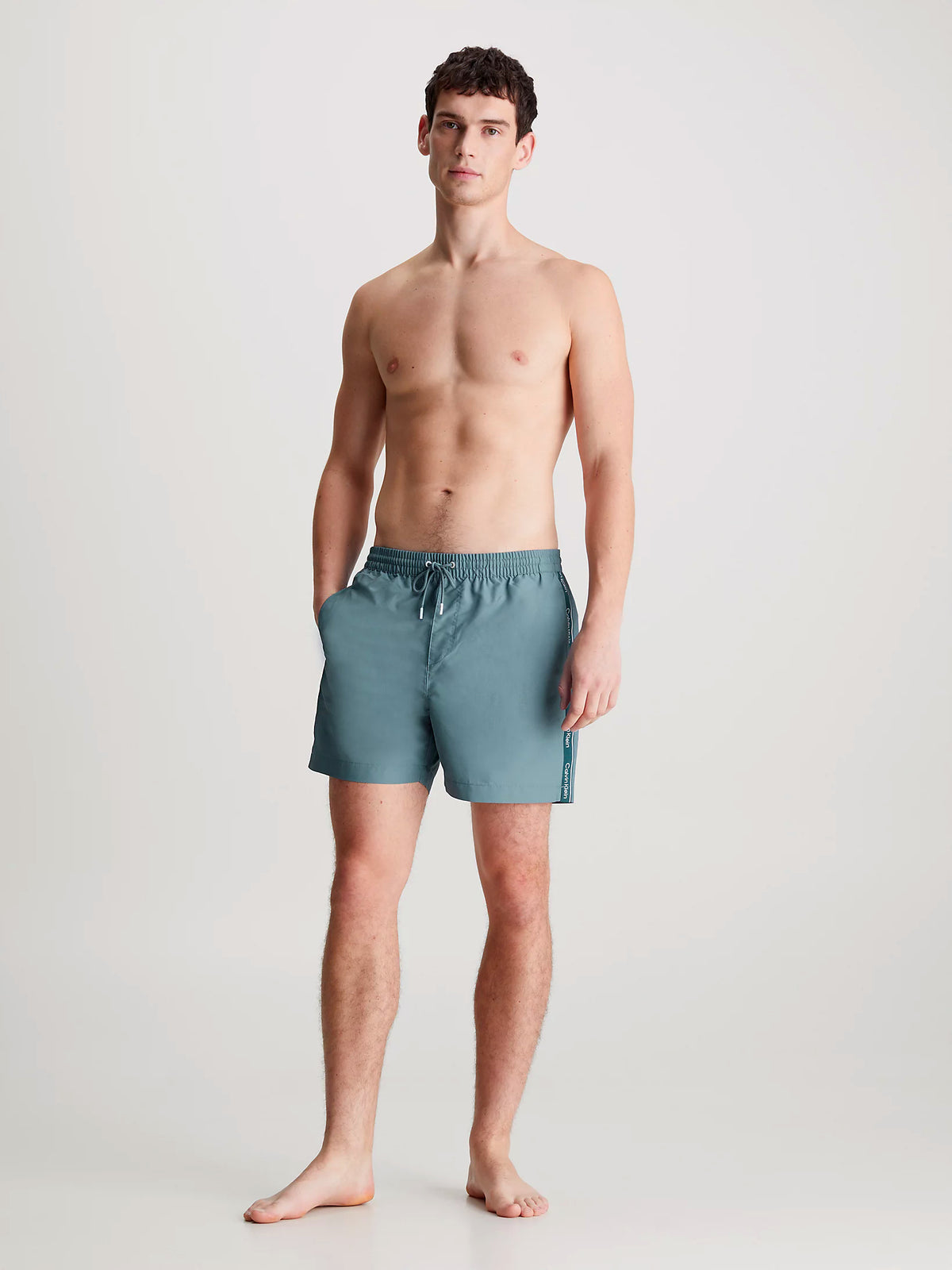 Calvin Klein Mens Medium Length Swim Short With Logo Tape, 04, Km0Km00955, Muted Cerulean